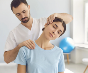 Woman getting her neck stretched by a doctor